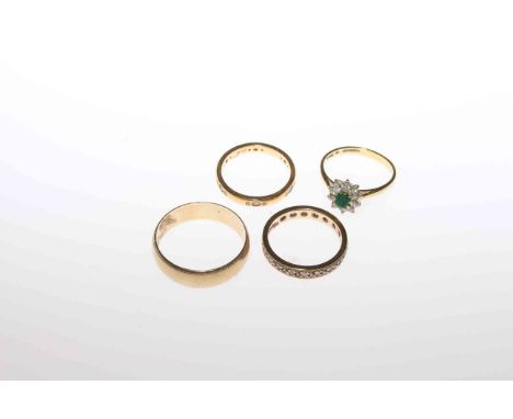 18 carat gold ring, 9 carat gold band, gold eternity ring and another eternity ring (4)