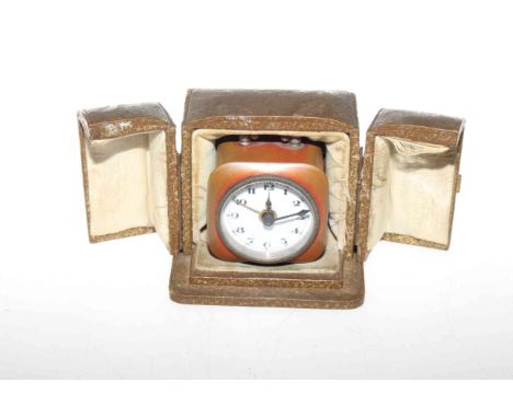 Travelling alarm clock, circa 1920-30, in an outer case