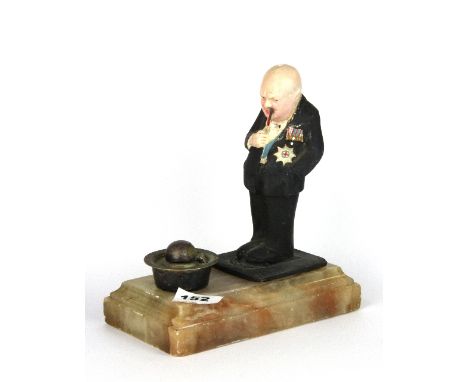 An interesting inkwell in the form of an upturned bowler hat with a plaster figure of Sir Winston Churchill on an alabaster b