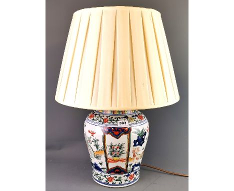 A Chinese hand painted porcelain jar, drilled close to the base and fitted as a table lamp, vase H. 32cm, overall 63cm.