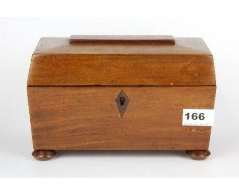 A polished mahogany sarcophagus shaped tea caddy, L. 23cm.