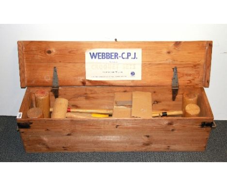 A pine cased vintage croquet set.