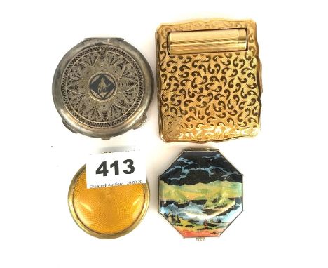 Four vintage compacts.