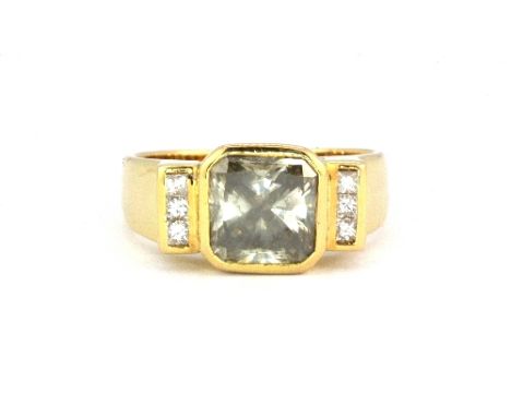 A heavy 18ct yellow gold (stamped 750) gentleman's ring set with and emerald cut champagne centre diamond approx. 3ct, (T).&n