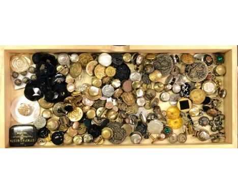 A tray of mixed vintage buttons.