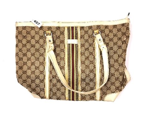 A vintage Gucci leather and fabric handbag.