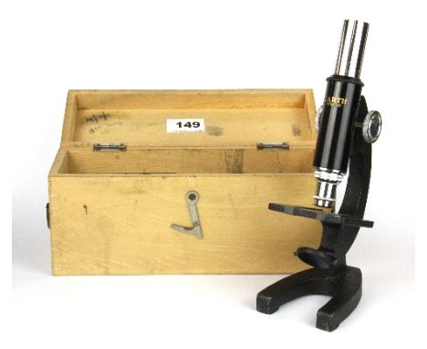 A cased vintage microscope.