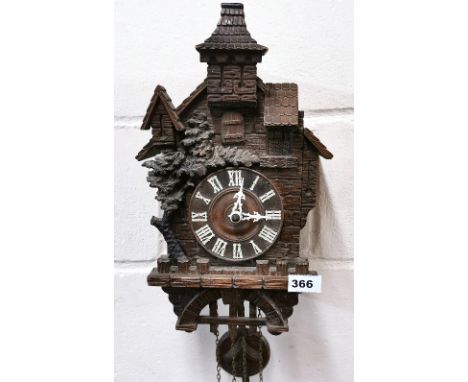 An early carved wooden Black Forest cuckoo clock, H. 54cm.