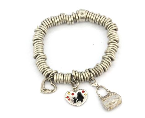 A 925 silver Links of London charm bracelet with three charms.