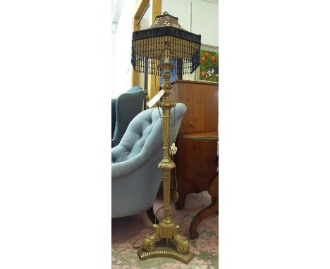FLOOR LAMP,  gilt metal with tasseled shade, 150cm H. 