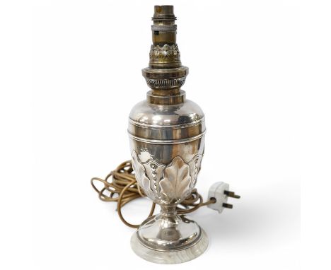 A late Victorian silver table lamp by William Hutton &amp; Sons London, 1894, wired for electricity and later? mounted on a w