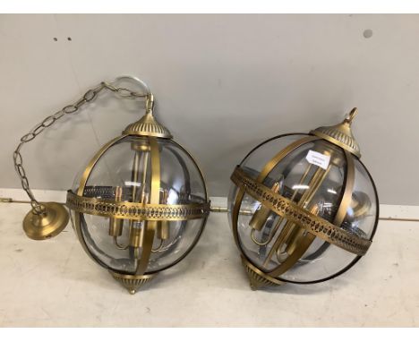 A pair of Contemporary gilt metal globe hall lanterns, height 36cm. Condition - good