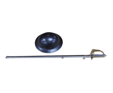 An officer's sword and WWII helmet. Condition - fair