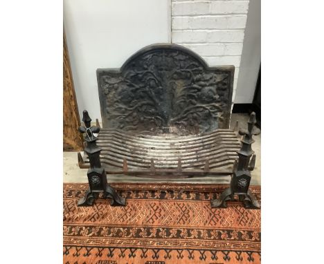 A cast iron fireback together with a fire grate, width 92cm, height 72cm and supporting fire dogs. Condition - fair