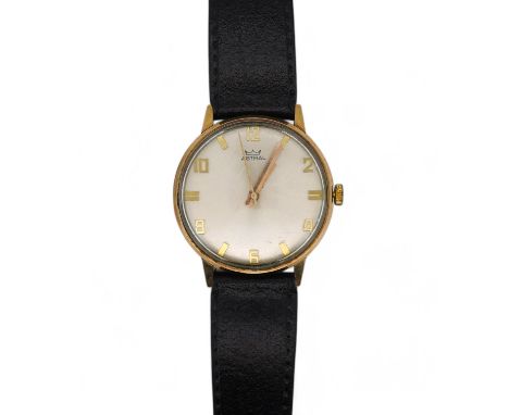 A gentleman's yellow metal Astral manual wind wrist watch, with engraved case back inscription, on a leather strap, with orig