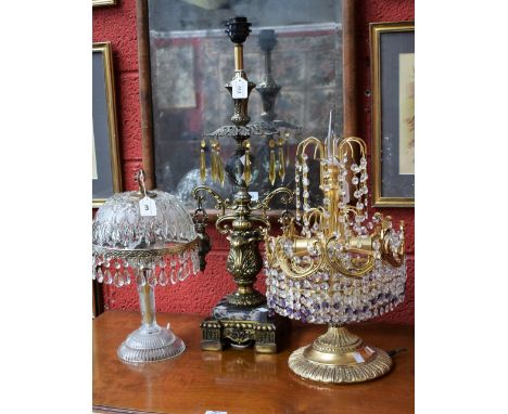 A gilt metal table lamp, cut glass droplets in clear and amethyst glass; another similar, moulded glass, clear cut glass drop