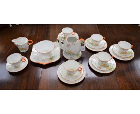 A Shelley part tea set, printed and painted with garden scene, gate, tree, flowers and butterflies, banded in orange, Reg No 