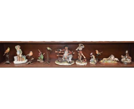 A Capodimonte figure, Naples mark, signed; another, similar; a Country Artists model, Otters; other resin animal models; bird