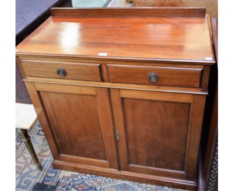 A George III style mahogany sideboard, of narrow proportions, rectangular top with half gallery above two frieze drawers and 