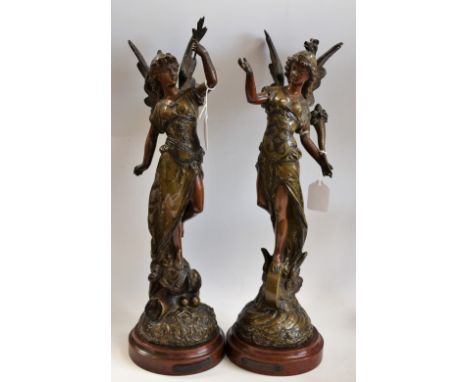 A pair of late 19th century French brown patinated spelter sculptures of La Paix and La Fortune, after Mage, each wearing arm