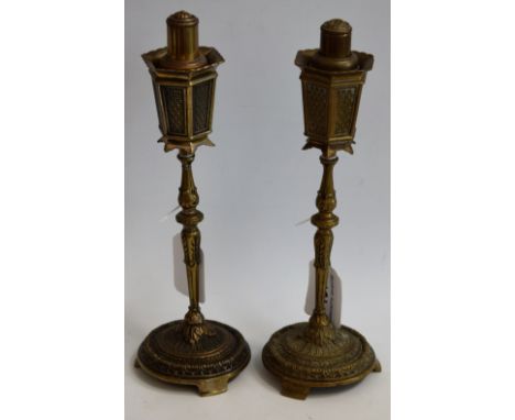 A pair of gilt metal novelty table lighters, as lamp posts, 24cm high