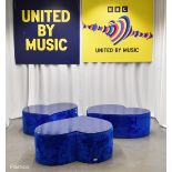 3x Asymmetrical heart shaped blue fur-covered wooden tables from countries' seating area
