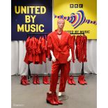 Red Outfits worn by backing dancers during the performance by Tina Karol of 'Show Me Your Love'