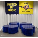 4x Asymmetrical heart shaped blue fur-covered wooden tables from countries' seating area