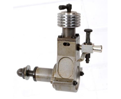 A John S Oliver Battle Axe R/C engine, with early R/C carburetor (1947), photographed on page 14 of the John Goodall book The
