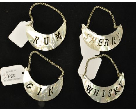 Four decanter labels