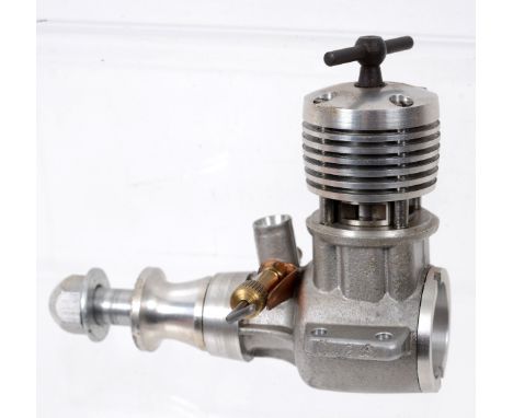 A John S Oliver 1.5cc Cub built in to a Schnuerle crank case, engine number C1238 (unused) boxed  See illustration