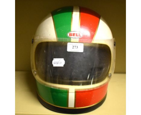 A circa 1970 Bell full face crash helmet with visor, and scruiteneer stickers