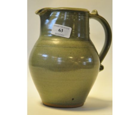 A St. Ives Bernard Leach celadon glaze jug, with impressed factory mark below the handle, 20 cm high