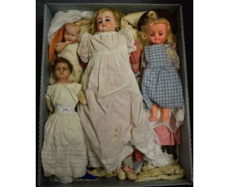 A wax head doll, with a composition body, 40 cm high, other assorted dolls, linen and textiles (qty)