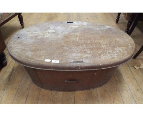 A late Victorian/Edwardian oval tin trunk, and cover, 86 cm wide