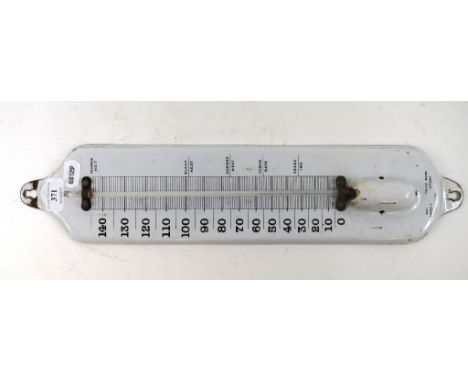 A white enamel thermometer, 32 cm high