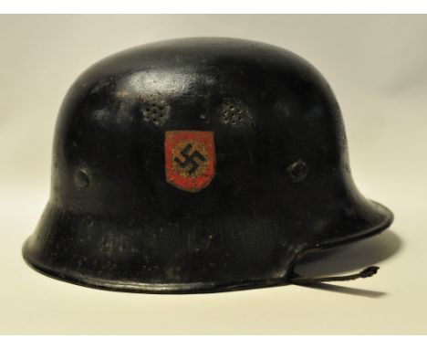 A German helmet, black painted, with side decals, lacks chin strap Condition report Please note that owing to the large numbe