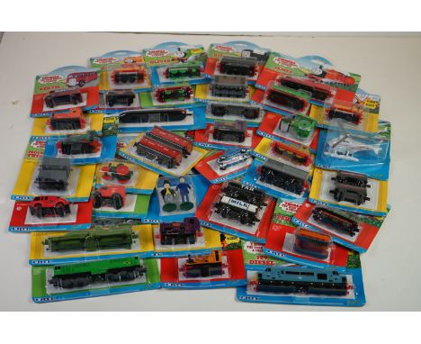35 x Ertl carded Thomas the Tank Engine diecast models to incliude Harold, George, Percy, Terence, etc 