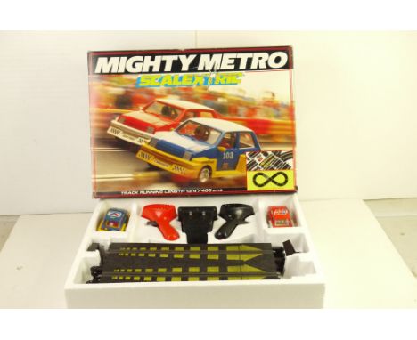 Boxed Scalextric Mighty Metro set with both original slot cars, and appearing complete 