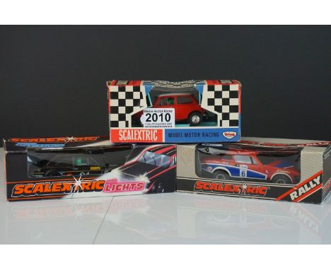Three boxed Scalextric slot cars to include Triang C7 Rally Mini Cooper in red, Rally C130 Triumph TR7 and C118 Ford Escort w