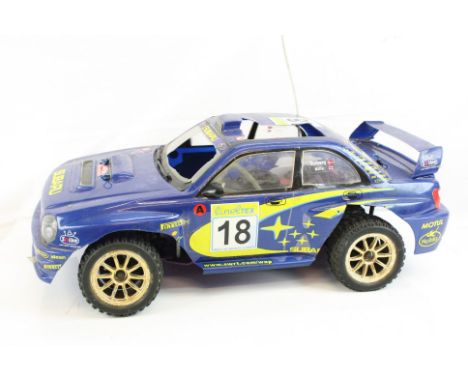 A CEN Sabaru WRX Rally shaft driven 4WD Nitro remote control car with an NX 3.0cc engine. 