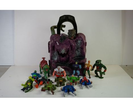 Collection of original Mattel He-Man Masters of the Universe to include MOTU Snake Mountain playset, playworn with broken cat