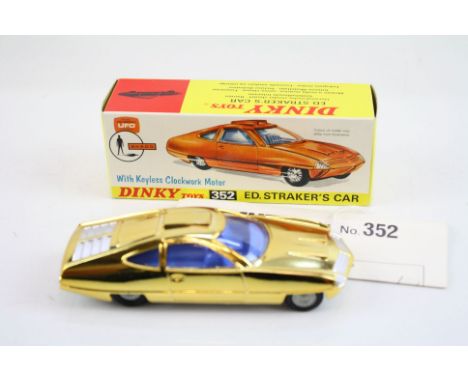 Boxed DInky 352 Gerry Anderson's UFO SHADO Ed Straker's Car diecast model in gold, with blue interior, complete with instruct