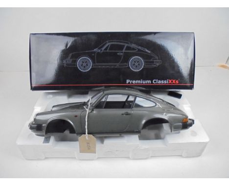 Boxed 1:12 scale limited edition Porsche 911 Carrera 3.2 coupe by Premium Classixxs. Only 500 pieces made. Front seats, engin