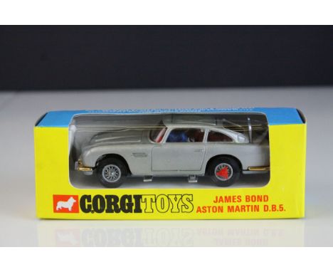 Boxed Corgi 270 James Bond 007 Aston Martin DB5 diecast model in blue/yellow box window, appearing near mint with unopened se