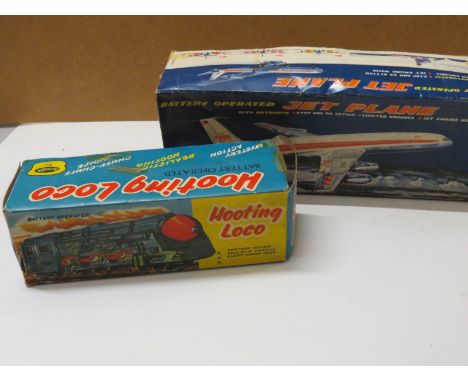 Two boxed tin plate battery operated toys to include Fairylite Hooting Loco and Marx (Japan) Jet Plane, boxes tatty, models i