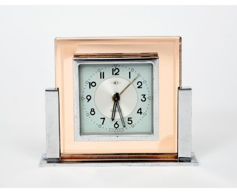 A DEP Savoy  desk alarm clock,  chrome Odeon style stand supporting peach tinted glass body, with square section case, arabic