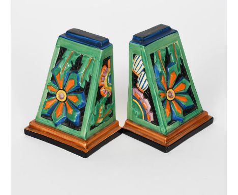 'Floreat' a pair of Clarice Cliff Fantasque Bizarre book ends,  cast in relief and painted in colours printed and painted mar
