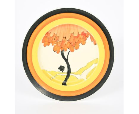 'House and Bridge' a Clarice Cliff plate, painted in colours inside yellow, orange and black bands, unsigned, impressed 1938 