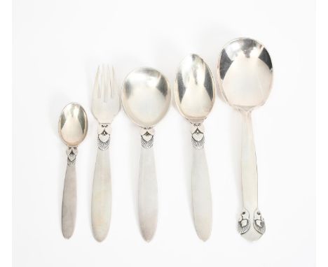 A Georg Jensen silver Cactus serving spoon designed by Gundolph Albertus, three other Cactus spoons a fork and three pairs of